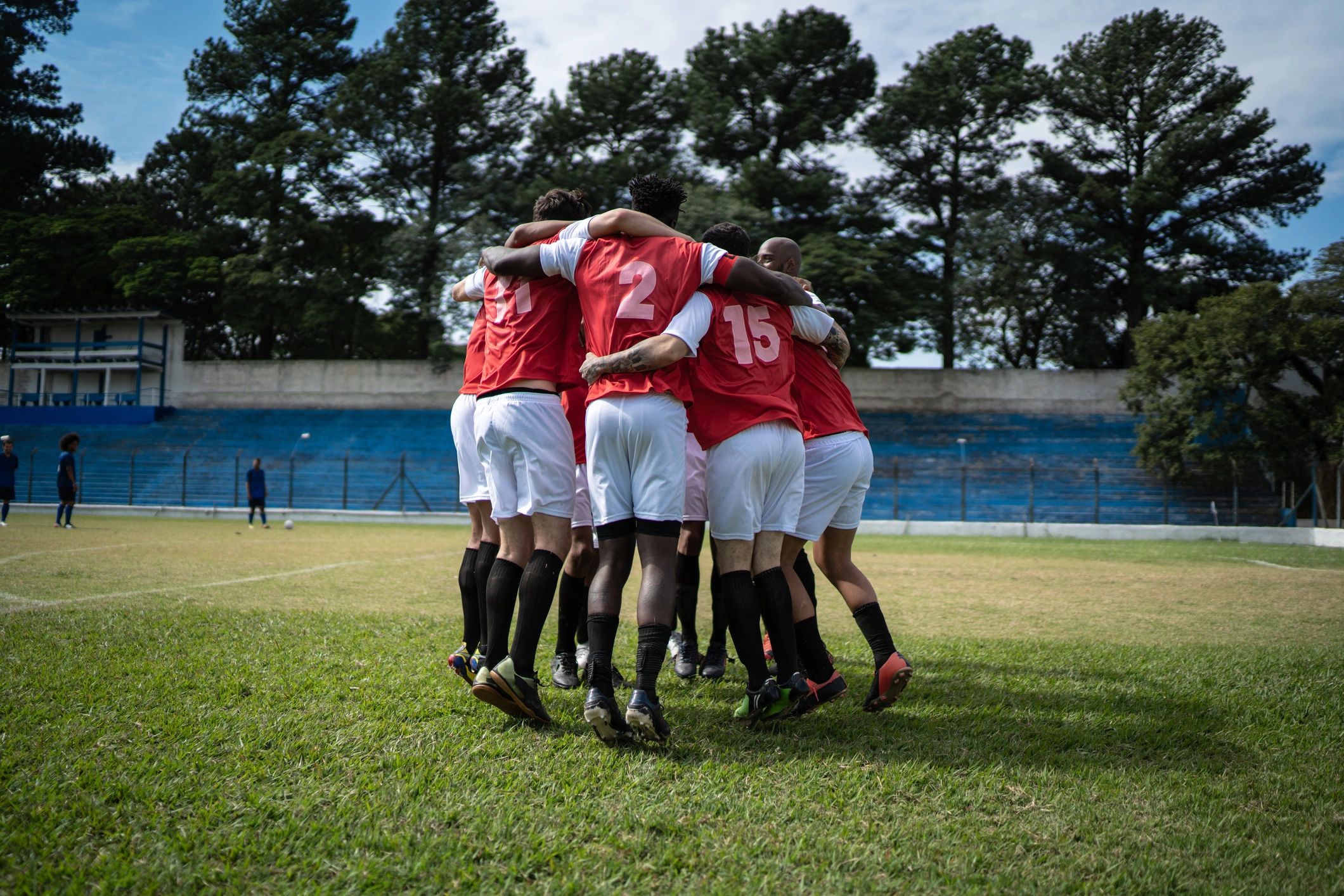 Soccer players celebrating together on the field
