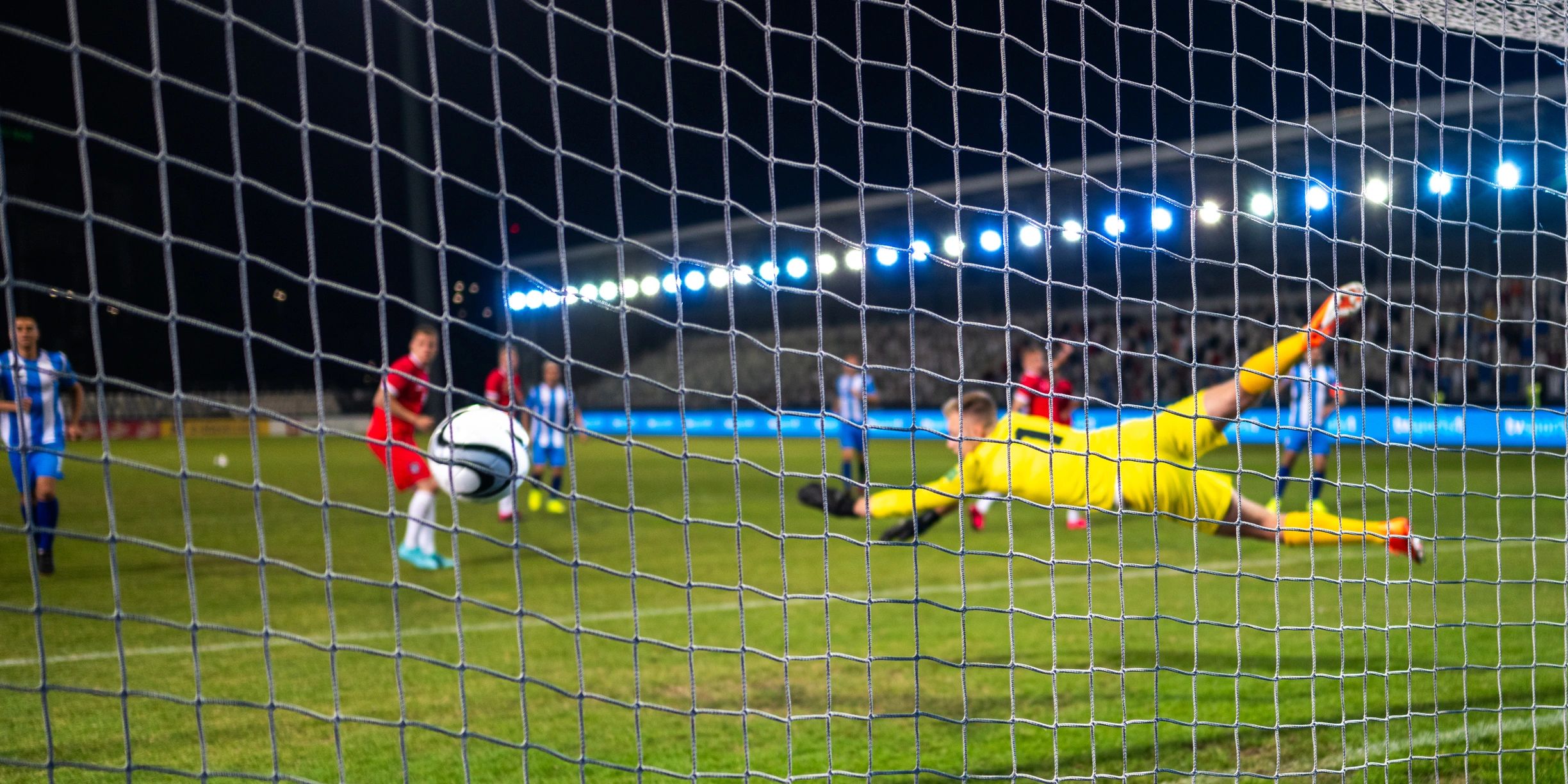 Goalkeeper making a save during a soccer match
