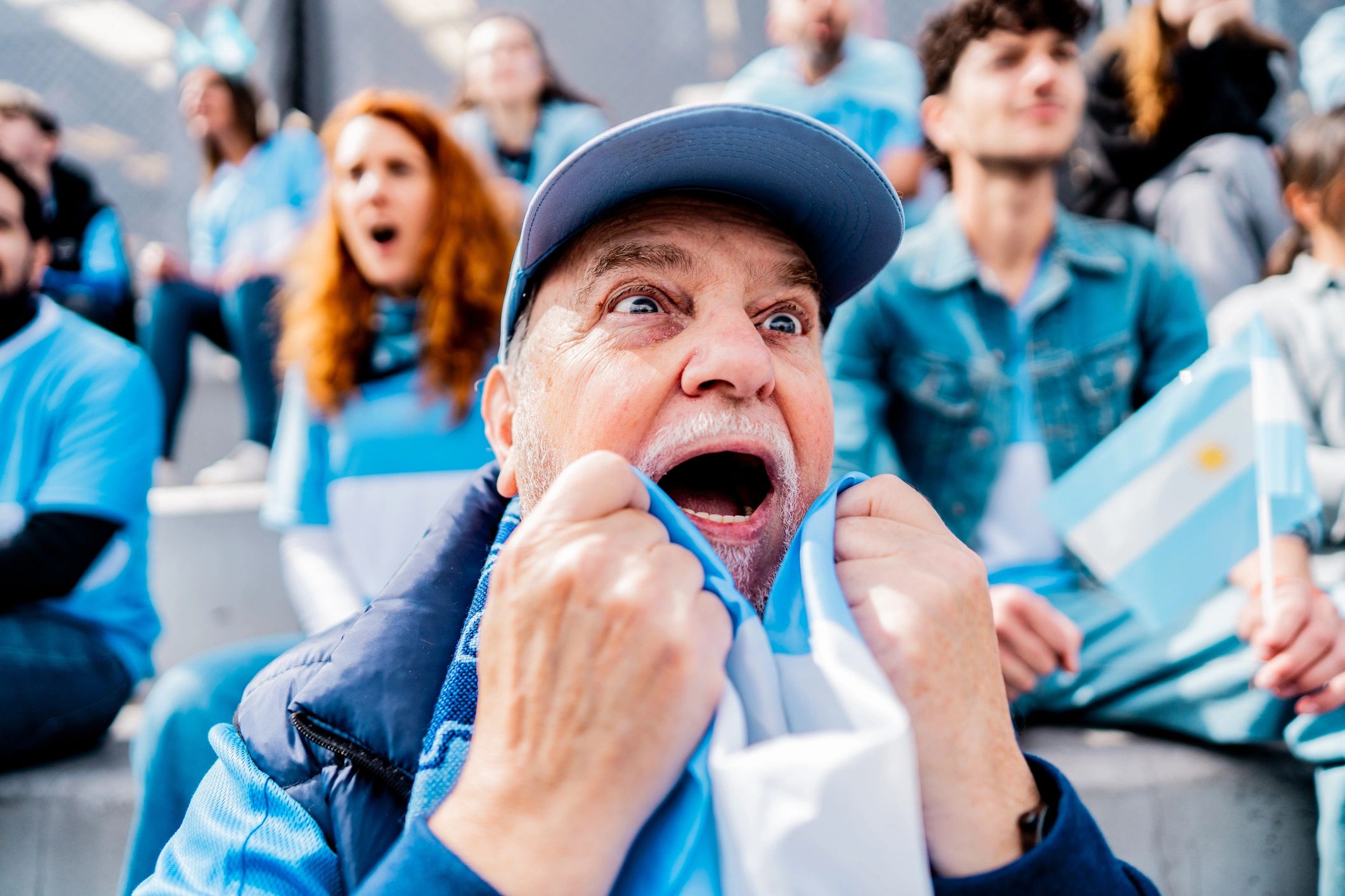 Supporter in the stands watching a soccer match